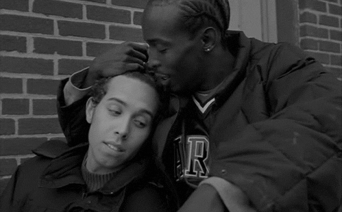 Gif of Omar from The Wire being sweet with his boyfriend, Brandon